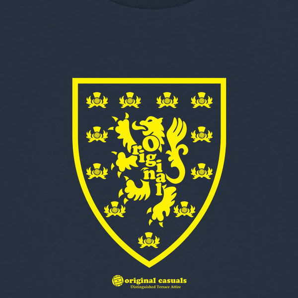 Yellow crest with a lion and text on a navy background, featuring the brand 'Original Casuals'.